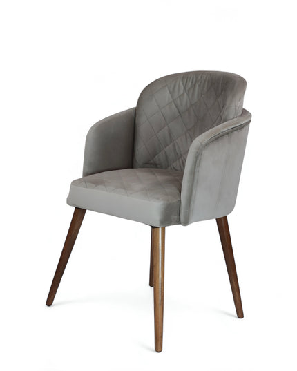 Modern dining chair with light grey diamond-stitched velvet upholstery and angled walnut wooden legs — ideal for contemporary interiors and luxury dining spaces.