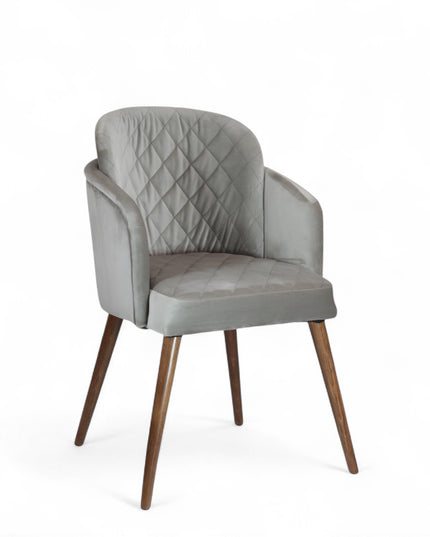 Modern dining chair with light grey diamond-stitched velvet upholstery and angled walnut wooden legs — ideal for contemporary interiors and luxury dining spaces.