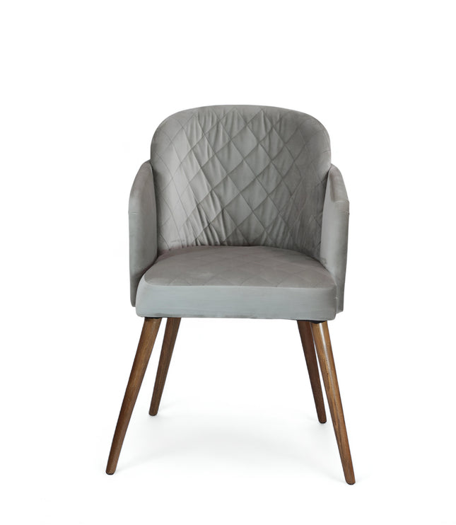 Modern dining chair with light grey diamond-stitched velvet upholstery and angled walnut wooden legs — ideal for contemporary interiors and luxury dining spaces.