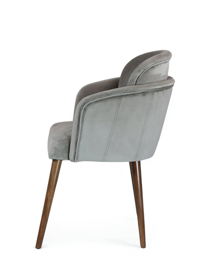 Modern dining chair with light grey diamond-stitched velvet upholstery and angled walnut wooden legs — ideal for contemporary interiors and luxury dining spaces.