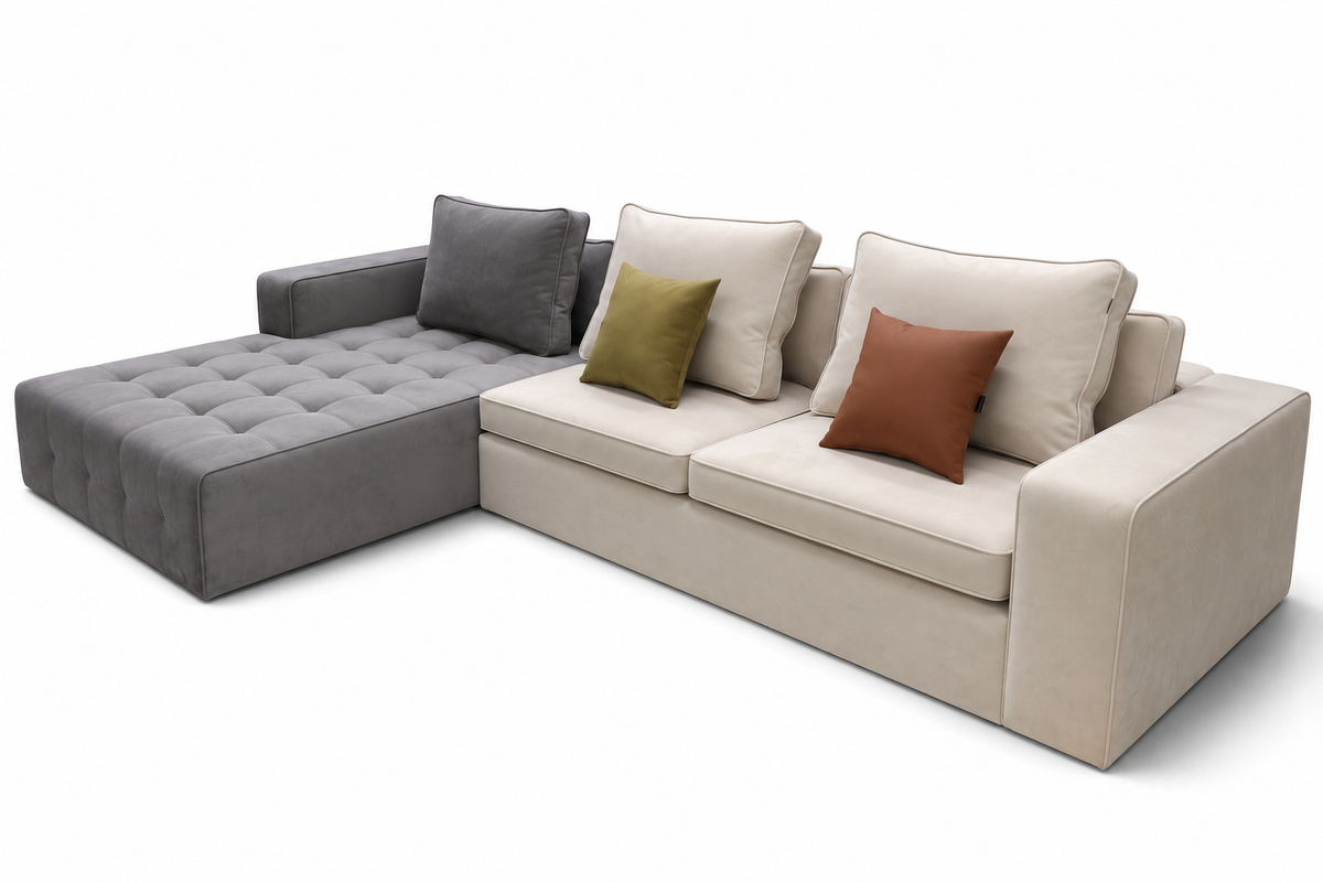 A modern L-shaped sectional sofa with a tufted chaise lounge on the left, upholstered in light beige fabric with a dark gray accent section. The sofa is styled with multiple throw pillows, including two beige pillows, one olive green pillow, and one rust brown pillow, set against a plain white background.