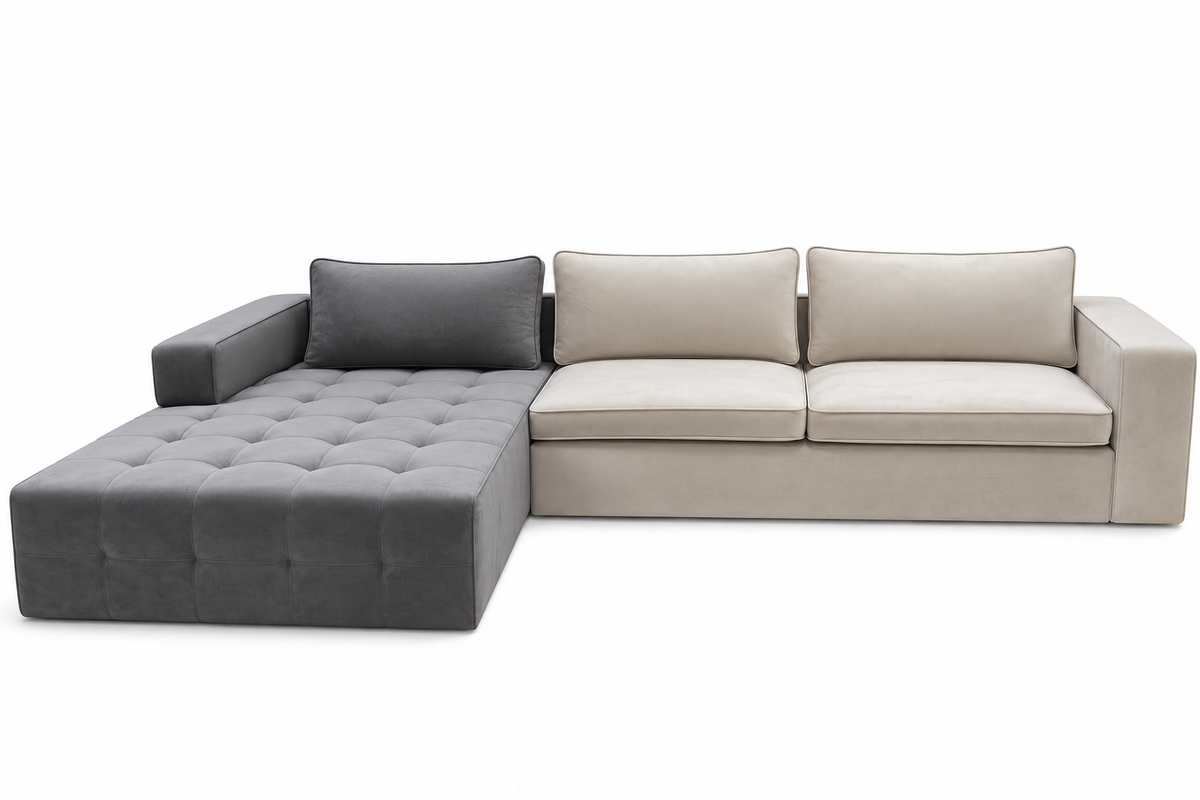 A modern sectional sofa with a left-facing chaise lounge, featuring a tufted dark gray chaise and matching back cushion, and light beige seat and back cushions on a plain white background.