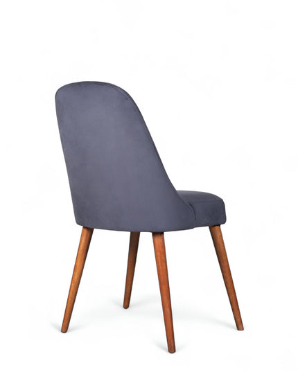 Modern armless blue chair with quilted seat, curved back, and wooden legs