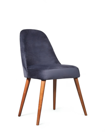 Modern armless blue chair with quilted seat, curved back, and wooden legs