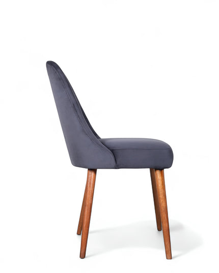 Modern armless blue chair with quilted seat, curved back, and wooden legs