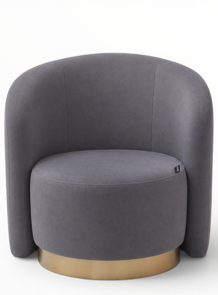 A modern barrel-style accent chair upholstered in dark gray fabric with a round gold metal base, shown against a plain white background.