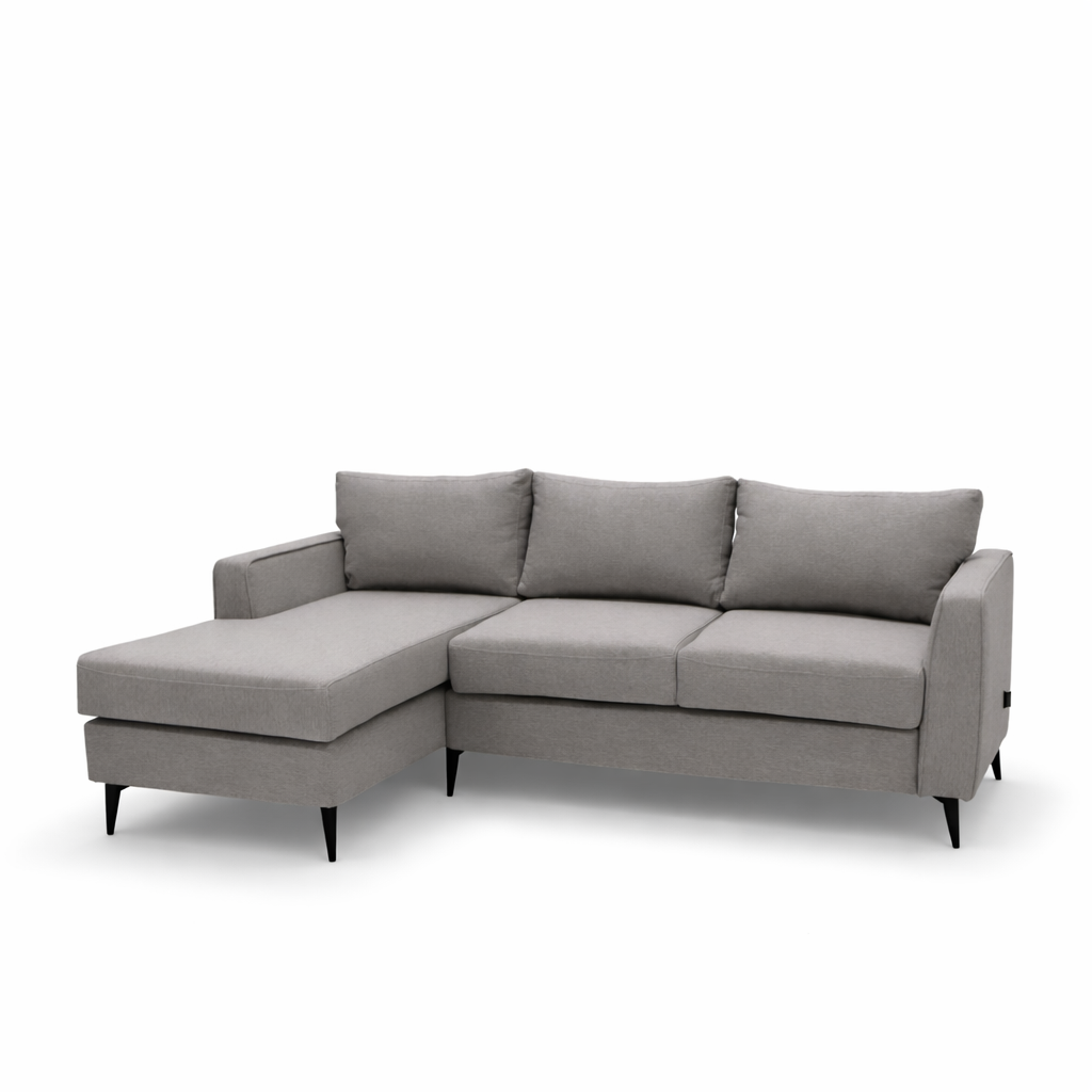 light gray fabric sectional sofa, highlighting the textured upholstery, plush back cushion, and clean stitched seams under soft, even lighting.