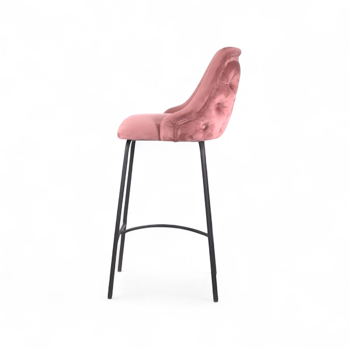 Modern bar stool with a high backrest and seat upholstered in blush pink velvet, featuring button-tufted detailing and slim black metal legs with a built-in footrest, ideal for kitchen islands or contemporary bar spaces