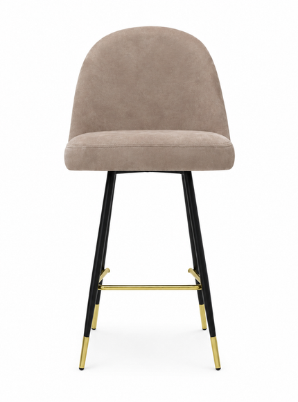 A modern bar stool with a rounded, upholstered seat and backrest in a taupe-beige fabric, supported by slim black metal legs accented with gold hardware and gold-colored foot caps, set against a plain white background.