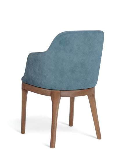 Contemporary dining chair with soft blue upholstery and natural wood legs — perfect for modern dining rooms, boutique cafés, or elegant home offices.