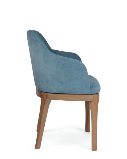 Contemporary dining chair with soft blue upholstery and natural wood legs — perfect for modern dining rooms, boutique cafés, or elegant home offices.