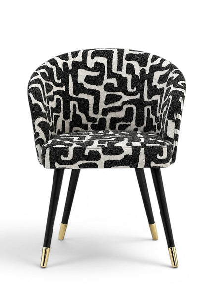 Chair with black and white patterned seat on a white background