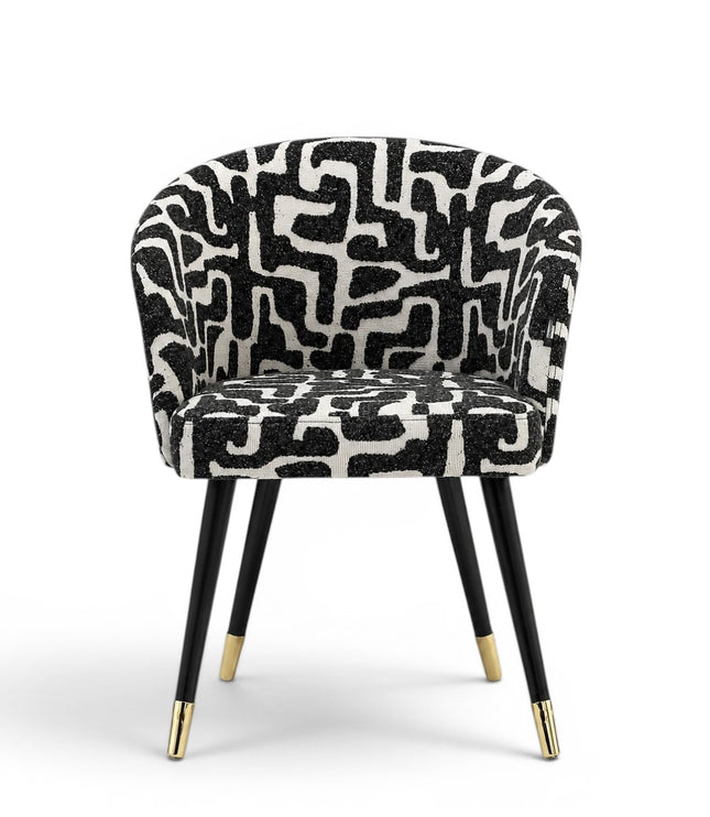 Chair with black and white patterned seat on a white background