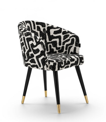 Chair with black and white patterned seat on a white background