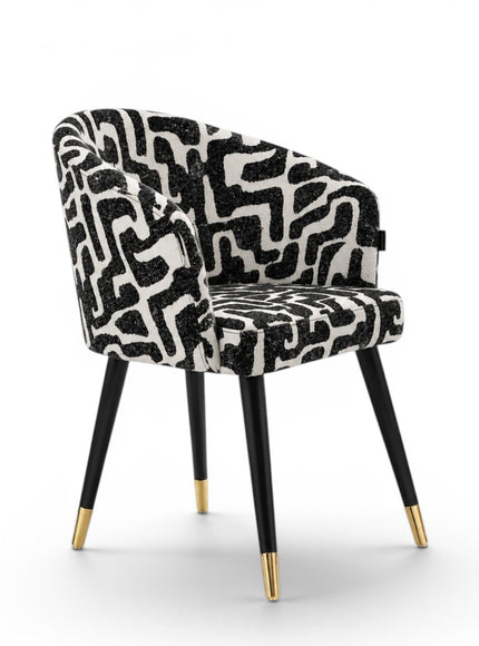 Chair with black and white patterned seat on a white background