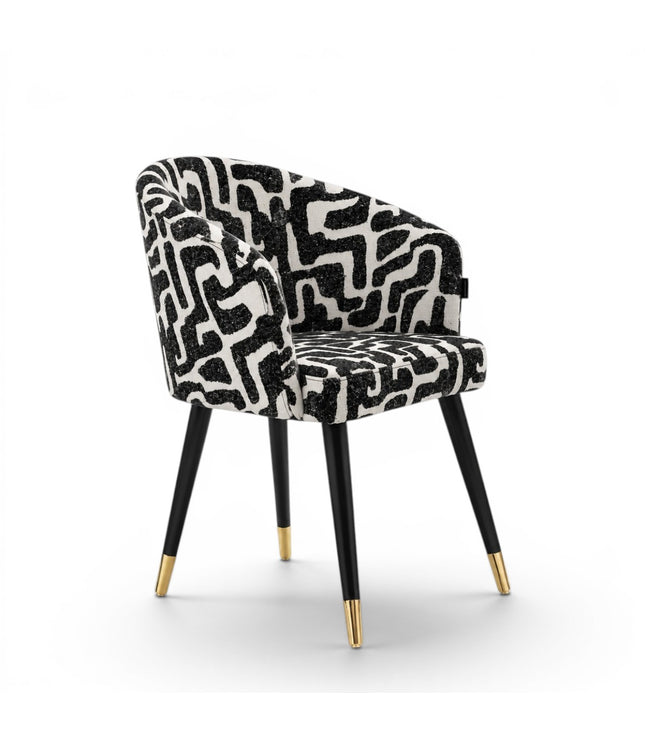 Chair with black and white patterned seat on a white background