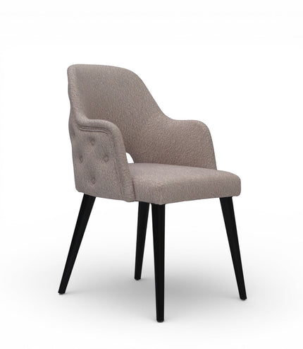 Beige upholstered chair with black legs on a white background