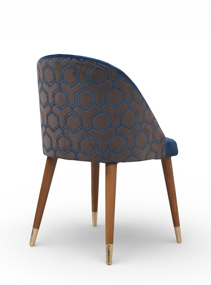 Chair with patterned backrest and wooden legs on a white background