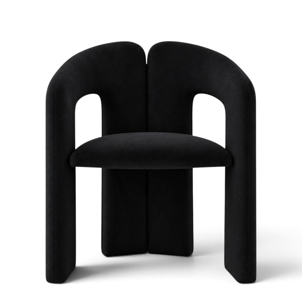 A modern black velvet dining chair with a unique split backrest and wide block legs, shown from the front on a white background.