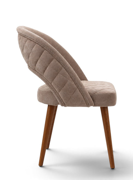 Argent beige upholstered dining chair with crescent-shaped backrest, quilted seat and tapered wooden legs.