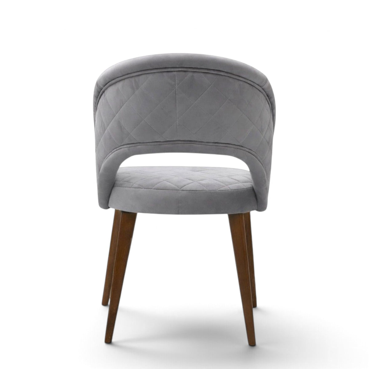 Argent grey upholstered dining chair with curved open backrest, diamond-quilted seat and brown wooden legs.