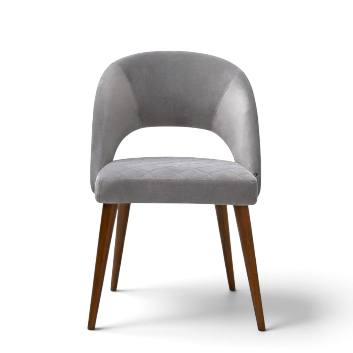 Argent grey upholstered dining chair with curved open backrest, diamond-quilted seat and brown wooden legs.