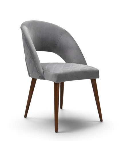 Argent grey upholstered dining chair with curved open backrest, diamond-quilted seat and brown wooden legs.