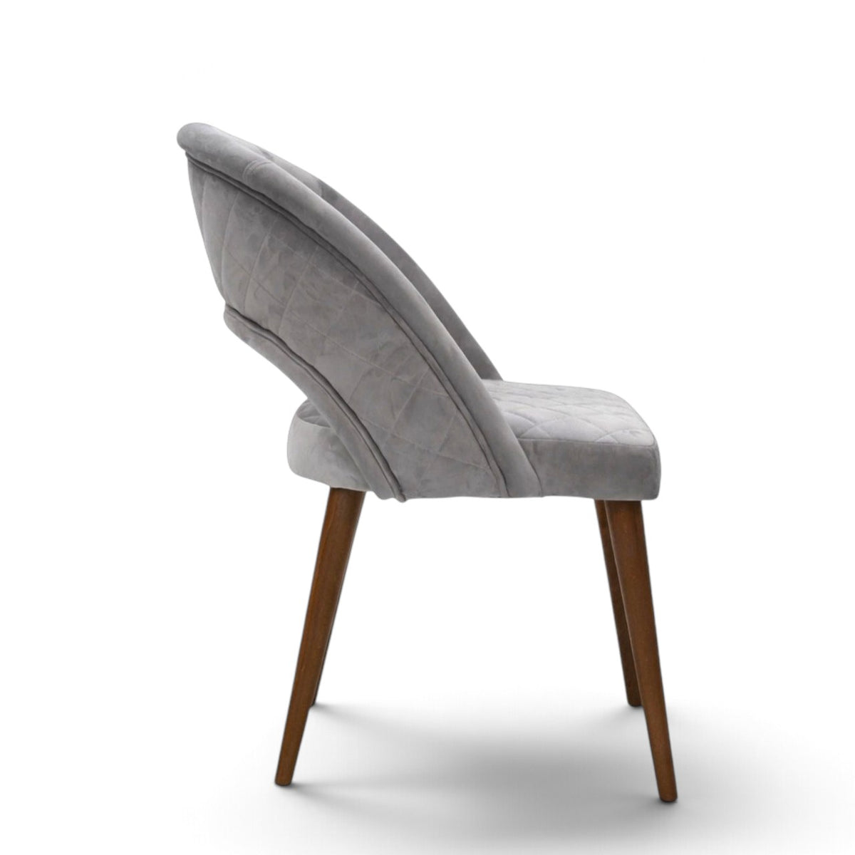Argent grey upholstered dining chair with curved open backrest, diamond-quilted seat and brown wooden legs.