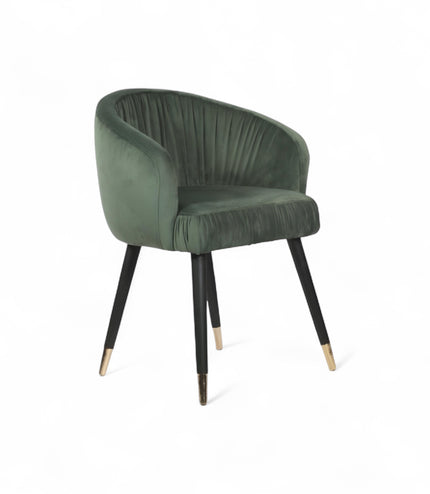 Modern forest green velvet barrel accent chair with pleated backrest and black metal legs with gold tips, perfect for living room or vanity seating.