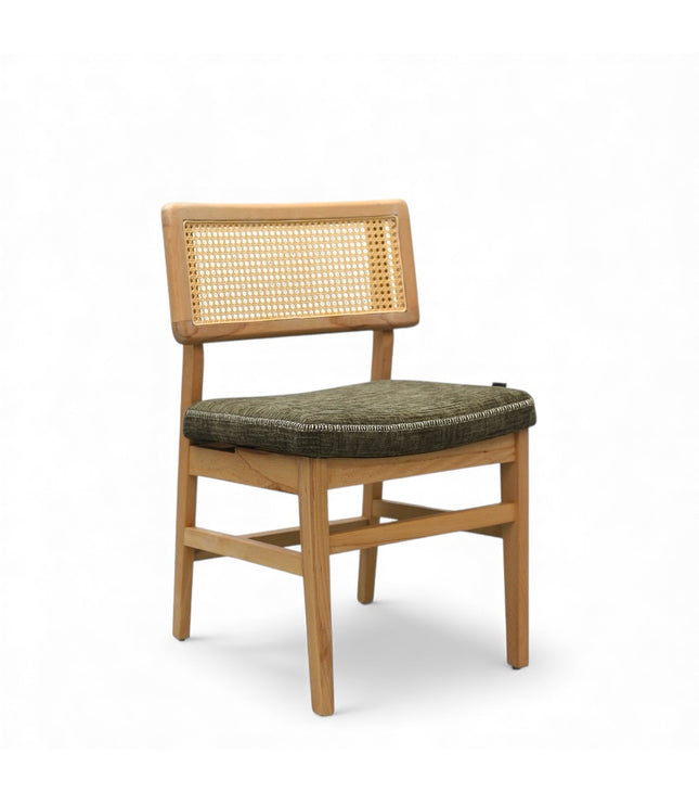 Close-up of a wooden chair with a woven rattan backrest and a textured green upholstered seat.