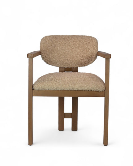 Modern wooden chair with beige boucle upholstery, featuring cushioned seat, rounded backrest, and minimalist armrests.