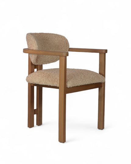 Modern wooden chair with beige boucle upholstery, featuring cushioned seat, rounded backrest, and minimalist armrests.