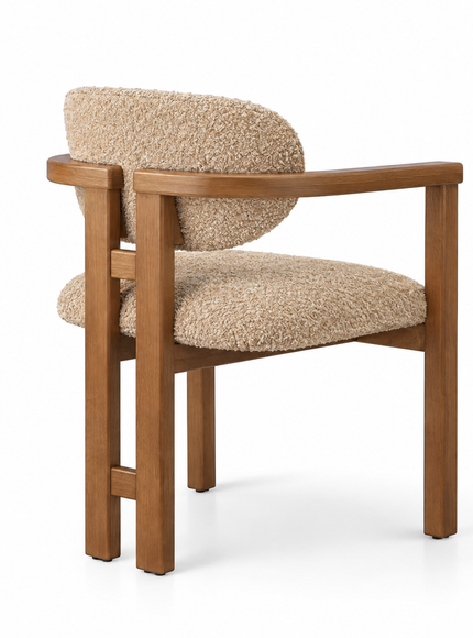 A modern wooden armchair with a textured beige bouclé upholstered seat and curved backrest, shown on a clean white background.