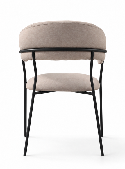 A modern dining chair with a curved upholstered backrest and seat cushion in a light beige fabric, supported by slim black metal legs, shown against a plain white background.