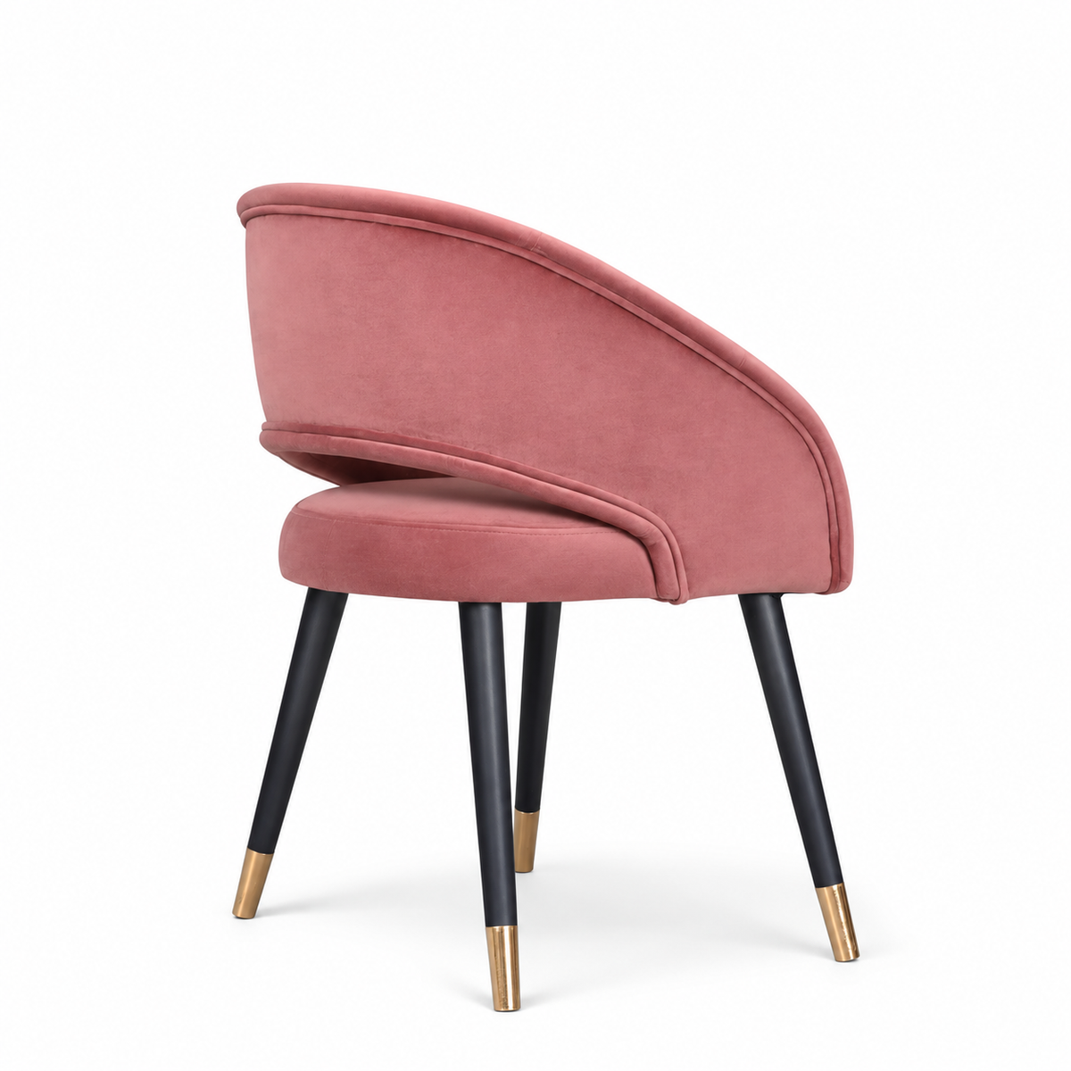Rosado dusty pink velvet dining chair with curved wraparound backrest, black tapered legs and gold tips.