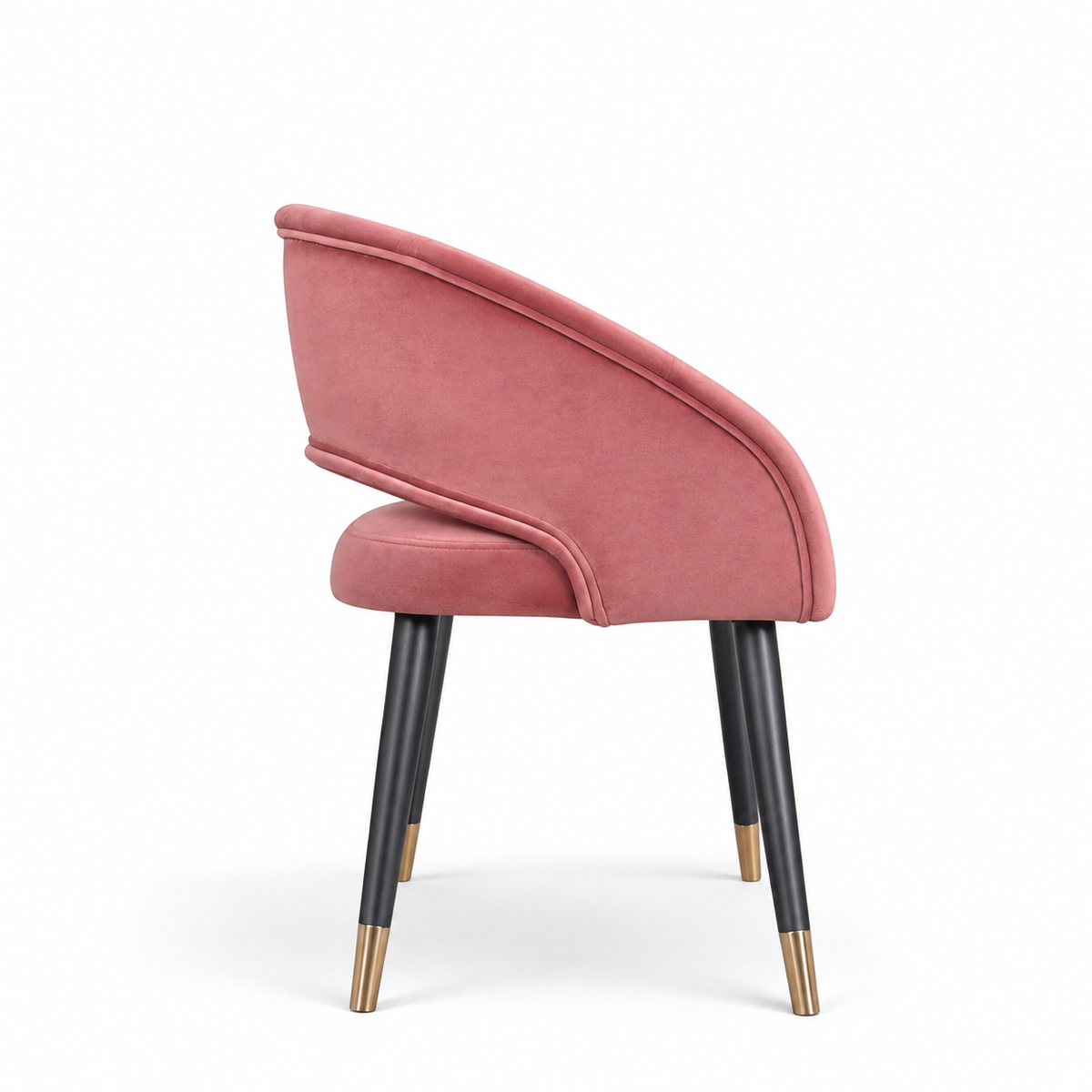 Rosado dusty pink velvet dining chair with curved wraparound backrest, black tapered legs and gold tips.