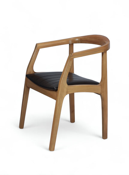 Front angled view of the Vaya Home Abre dining chair with a sculpted wood frame and black upholstered seat.
