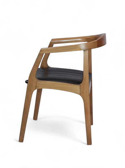 Opposite side view of the Vaya Home Abre dining chair with a curved wood frame, open armrests, and black upholstered seat.