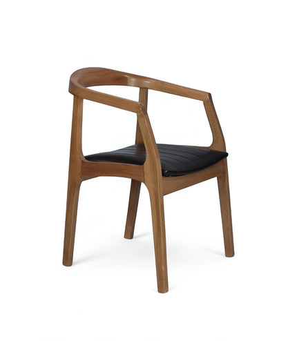 Product view of the Vaya Home Abre dining chair with a curved wood frame and black upholstered seat.