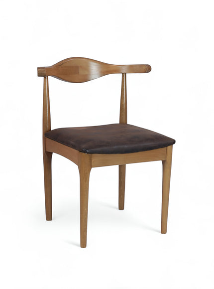 Vaya Home Albero dining chair with a sculpted wood frame and brown upholstered seat.