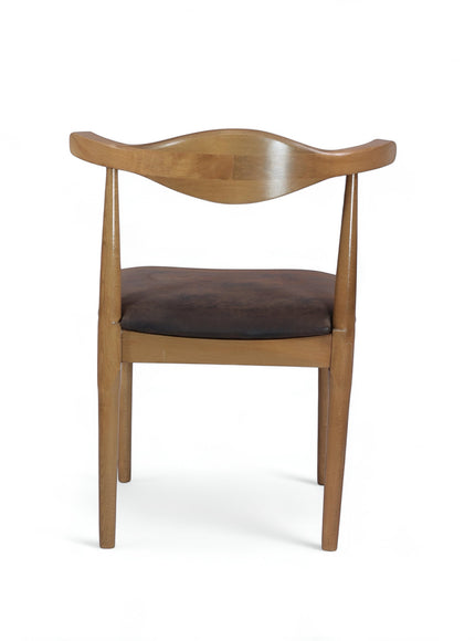 Front view of the Vaya Home Albero dining chair with a curved wood backrest and brown upholstered seat.