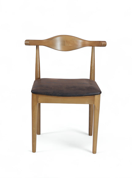 Product view of the Vaya Home Albero dining chair with a sculpted wood frame and brown upholstered seat.