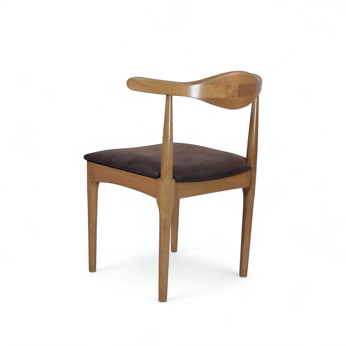 Rear angled view of the Vaya Home Albero dining chair with a sculpted wood frame and brown upholstered seat.