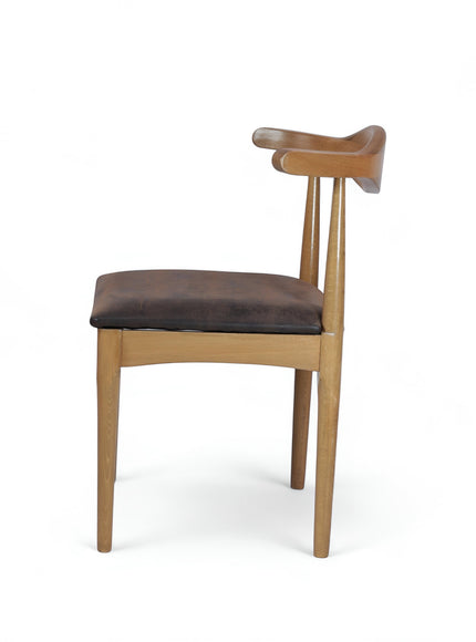 Opposite side view of the Vaya Home Albero dining chair featuring a sculpted wood backrest and brown upholstered seat.