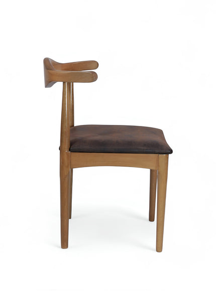Side view of the Vaya Home Albero dining chair with a sculpted wood frame and brown upholstered seat.