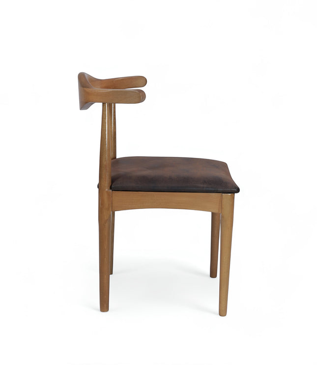 Side view of the Vaya Home Albero dining chair with a sculpted wood frame and brown upholstered seat.