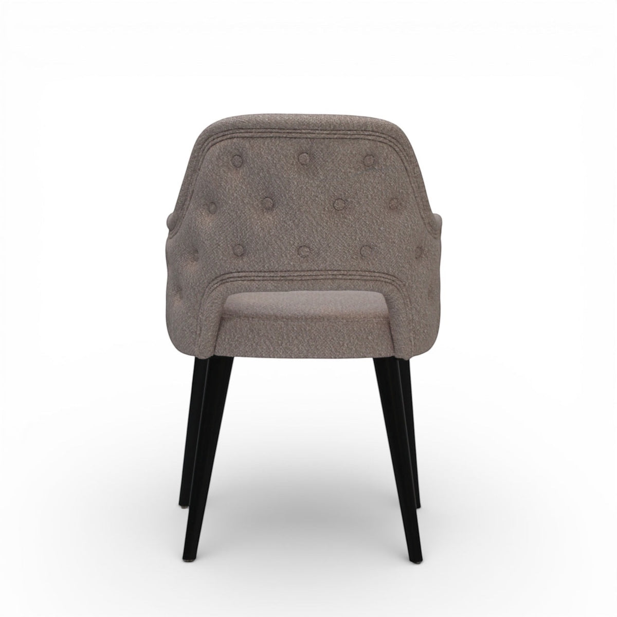 Back view of the Vaya Home Alt dining chair with beige upholstery, button-tufted outer back, and black tapered legs.
