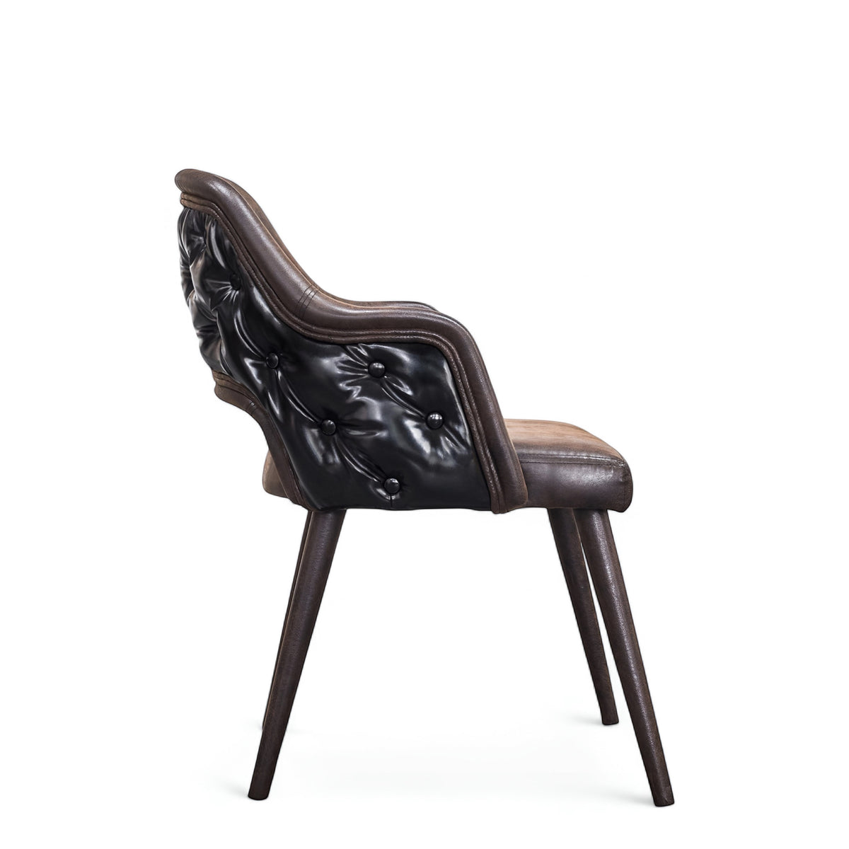 Side rear view of the Vaya Home Alt dining chair featuring dark brown leather upholstery, a curved button-tufted back, and tapered wood legs.