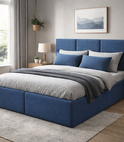Vaya Home Alturo upholstered bed in blue fabric with a paneled headboard, styled in a modern bedroom.