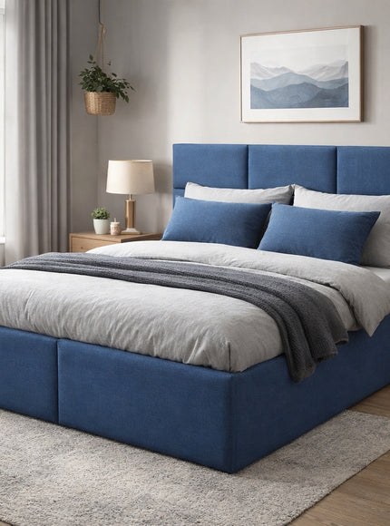 Vaya Home Alturo upholstered bed in blue fabric with a paneled headboard, styled in a modern bedroom.